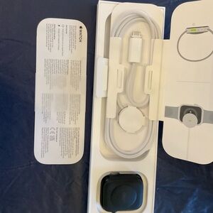 Apple Smartwatch with Black Face and White Accessories